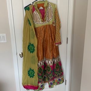 A green and orange anarkali with duptta and salwar